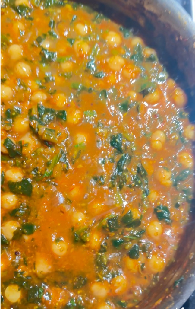 This dish is full of warming spices and rich coconut milk. It contains protein-packed chickpeas and nourishing greens. This combination is everything you could ever want in a comforting curry