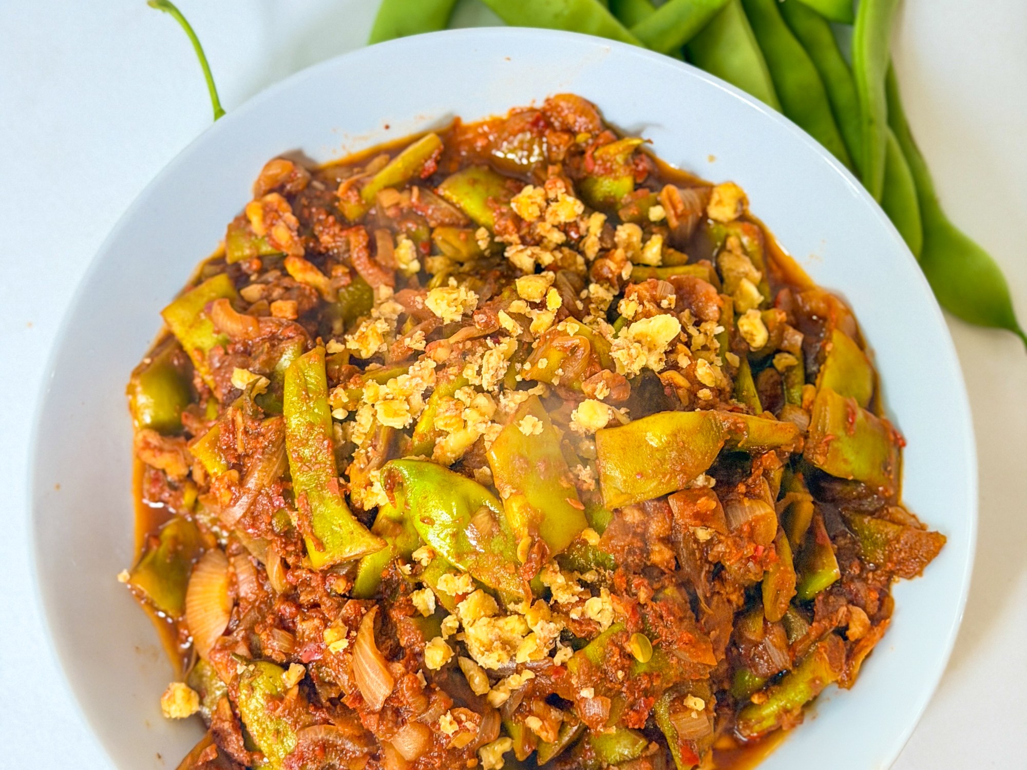 Braised Broad Beans with Tomatoes, Garlic, Walnuts & Pomegranate Molasses