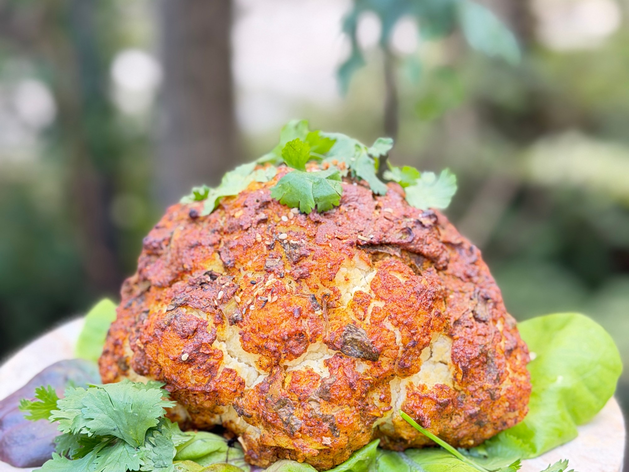 A whole cauliflower marinated in creamy spiced yogurt and roasted until golden, caramelized and tender
